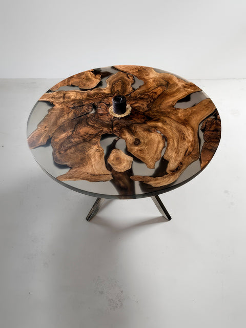 Round dining table from walnut root with smoky matte resin Amara