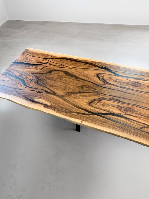 Dining table of solid walnut with grey epoxy resin Maestoso
